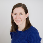 Emma Bacharach, PA-C, who specializes in orthopedic surgery, is smiling for her headshot.