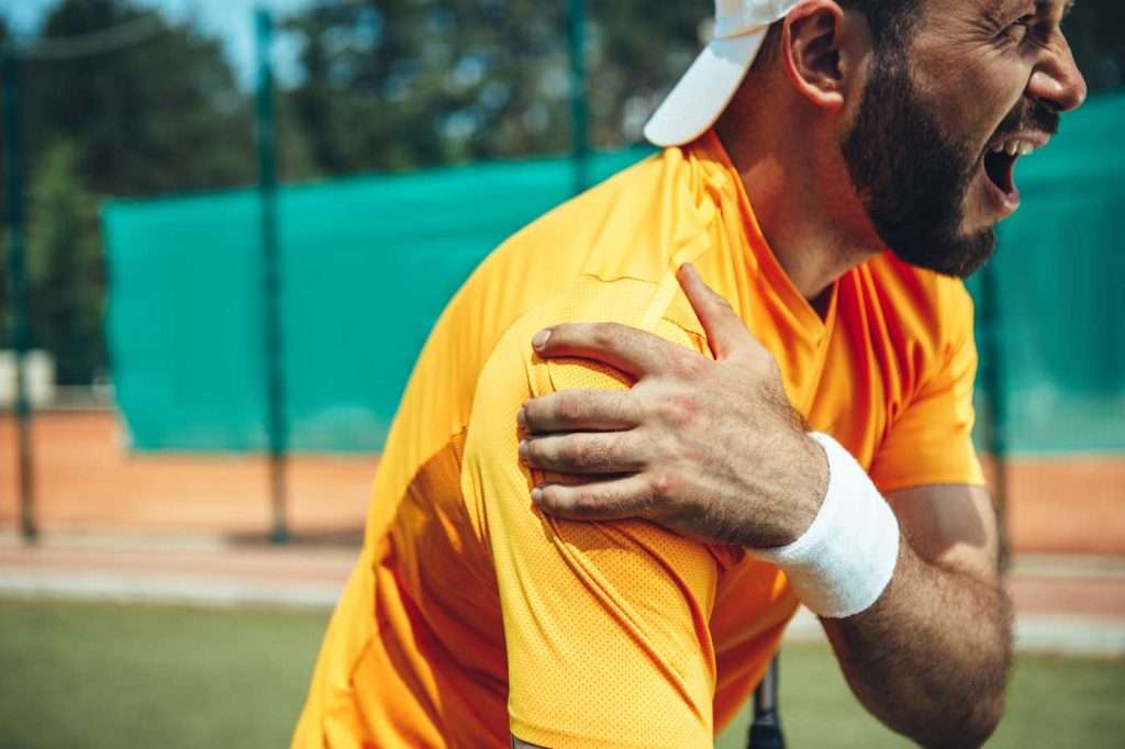 Tennis player grimacing