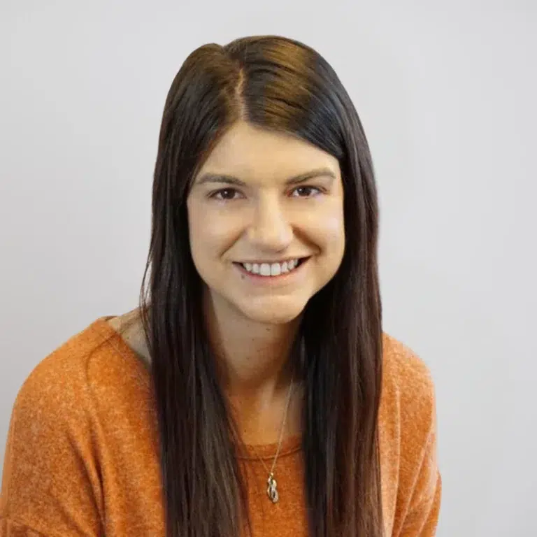 Ashten Howard, who is a physician assistant in the orthopedics and spine surgery department at Swift Institute, is smiling for her headshot